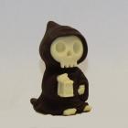 A skeleton with a hood,  made entirely of chocolate