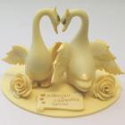 Cake topper or table centerpiece of white chocolate swans with gold decoration handmade and customized message