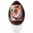 An Easter Egg with a wrinkled surface and a name plate in white milk chocolate that can be customized with the images and messages of your choice.