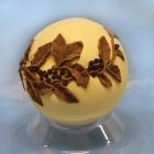 chocolate ball with raised decoration, light golden