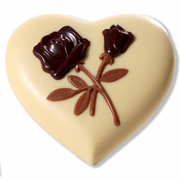 Cuore di cioccolato bianco  con rose in rilievo.